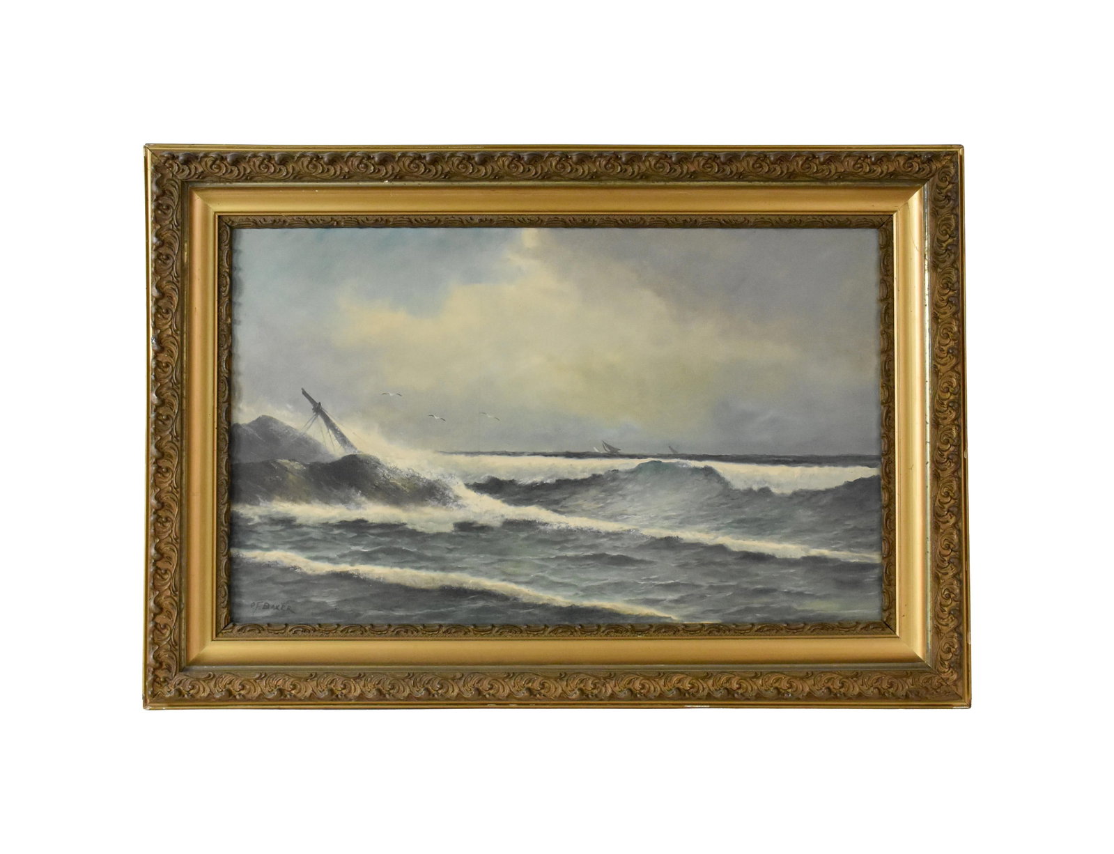 O.F. Baker Painting: (19th C.) Oil on canvas. Depicts a shipwreck off a rocky coast. Signed lower left. Sight size: 21 3/4" high x 39 1/2" wide. In a period 19th C. gesso frame measuring: 30 1/2" high x 44 1/2" wide.