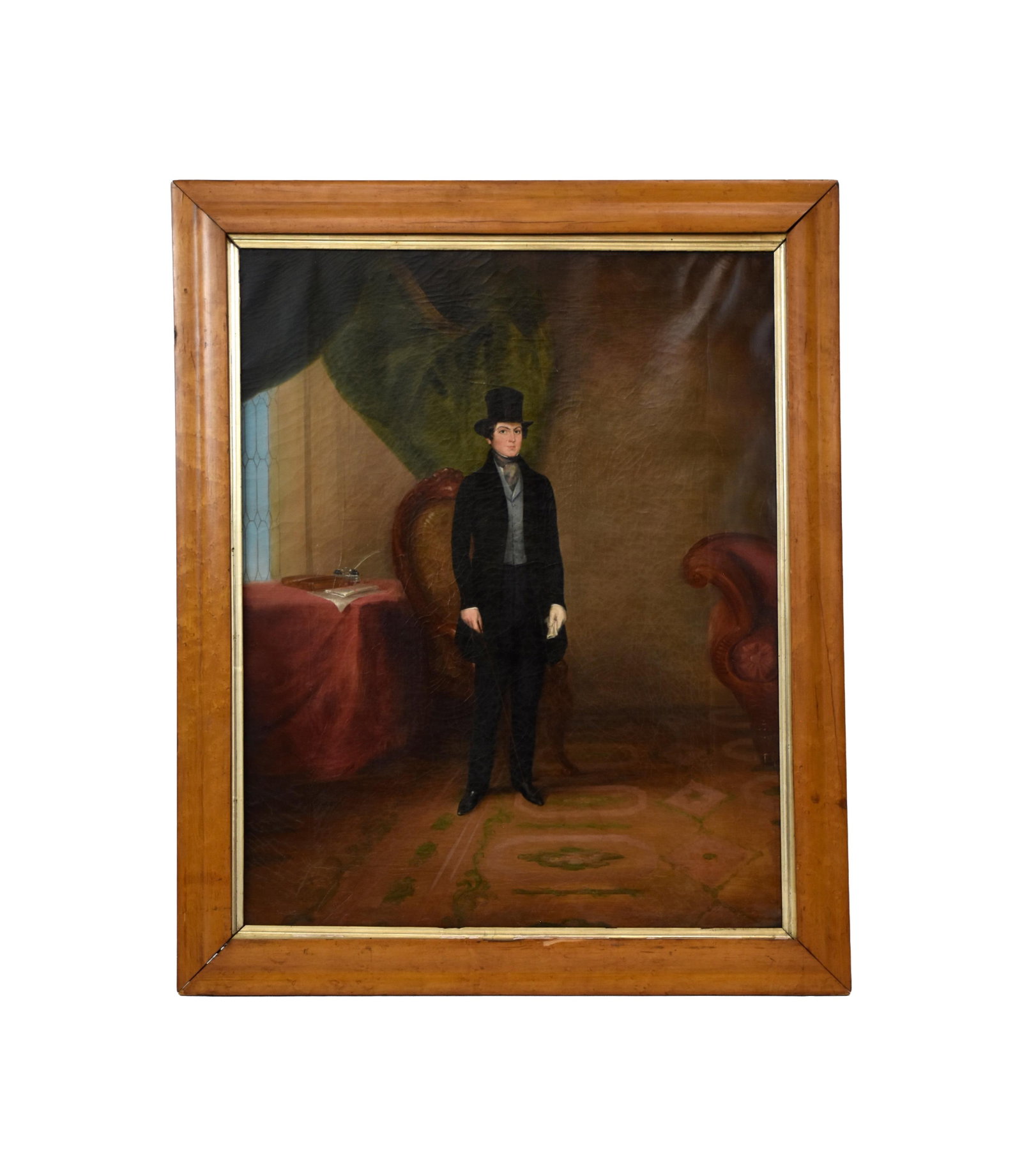 Folk Art Portrait: Late the 19th. Oil on canvas. Depicts a handsome young man in a suit and top hat. Sight size: 28 1/2" high x 22 1/2" wide. In a burled walnut frame measuring: 34 1/4" high x 28" wide. UV light shows