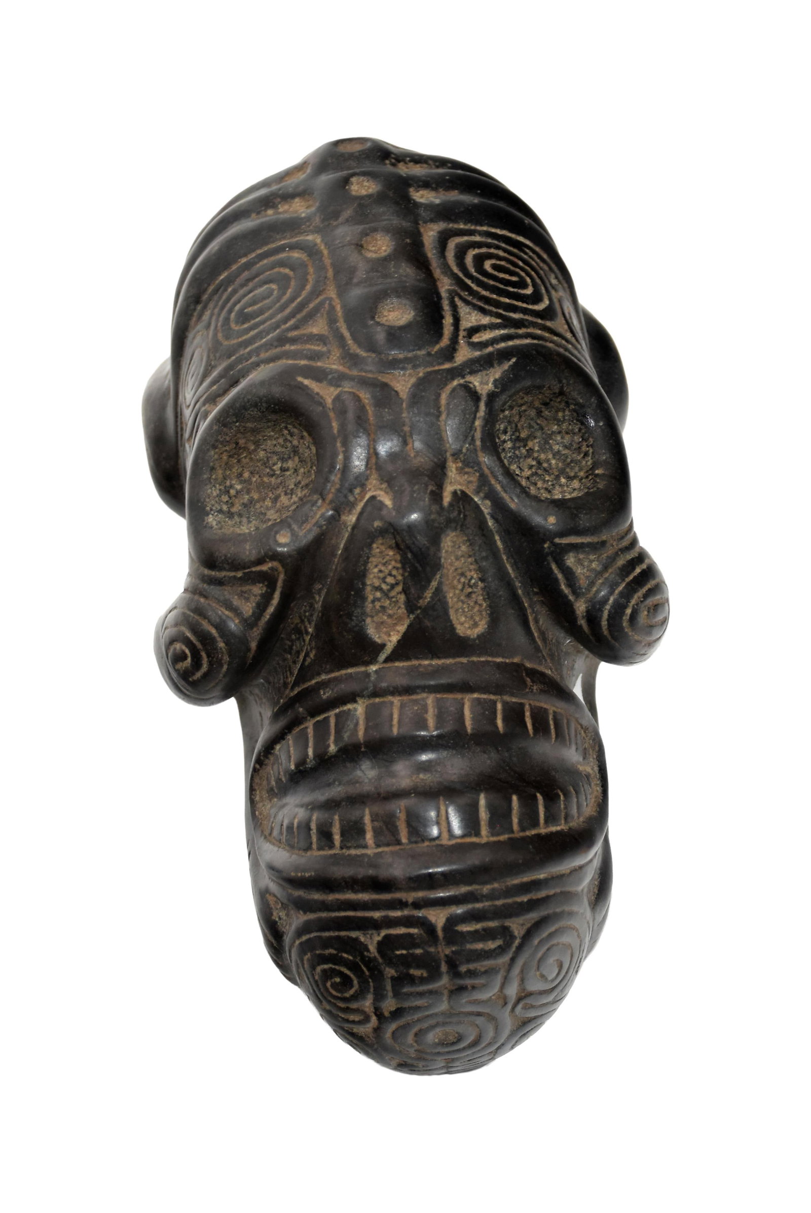 Taino Ancestral Head with Residual Body: Ca. 600-1500 AD. Magnetite. 5 1/2" high x 4 3/4" wide x 8 1/4" long. Enlarged heads were often portrayed in Taino art as being the center of knowledge and hallucinogenic visions. See Taino Zemis and