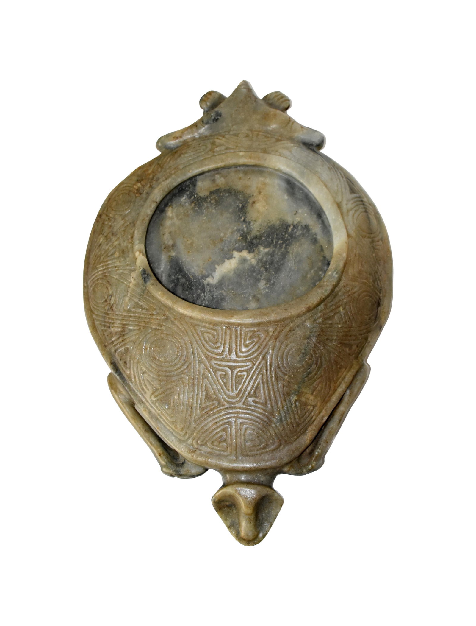Taino Turtle Vessel: Ca. 600-1500 AD. Marble. 19" long x 2 3/4" high x 13" wide. A series of intricately incised interfacing bird heads fills the surface of the turtle's carapace. A circular ridge surrounds the vessel's