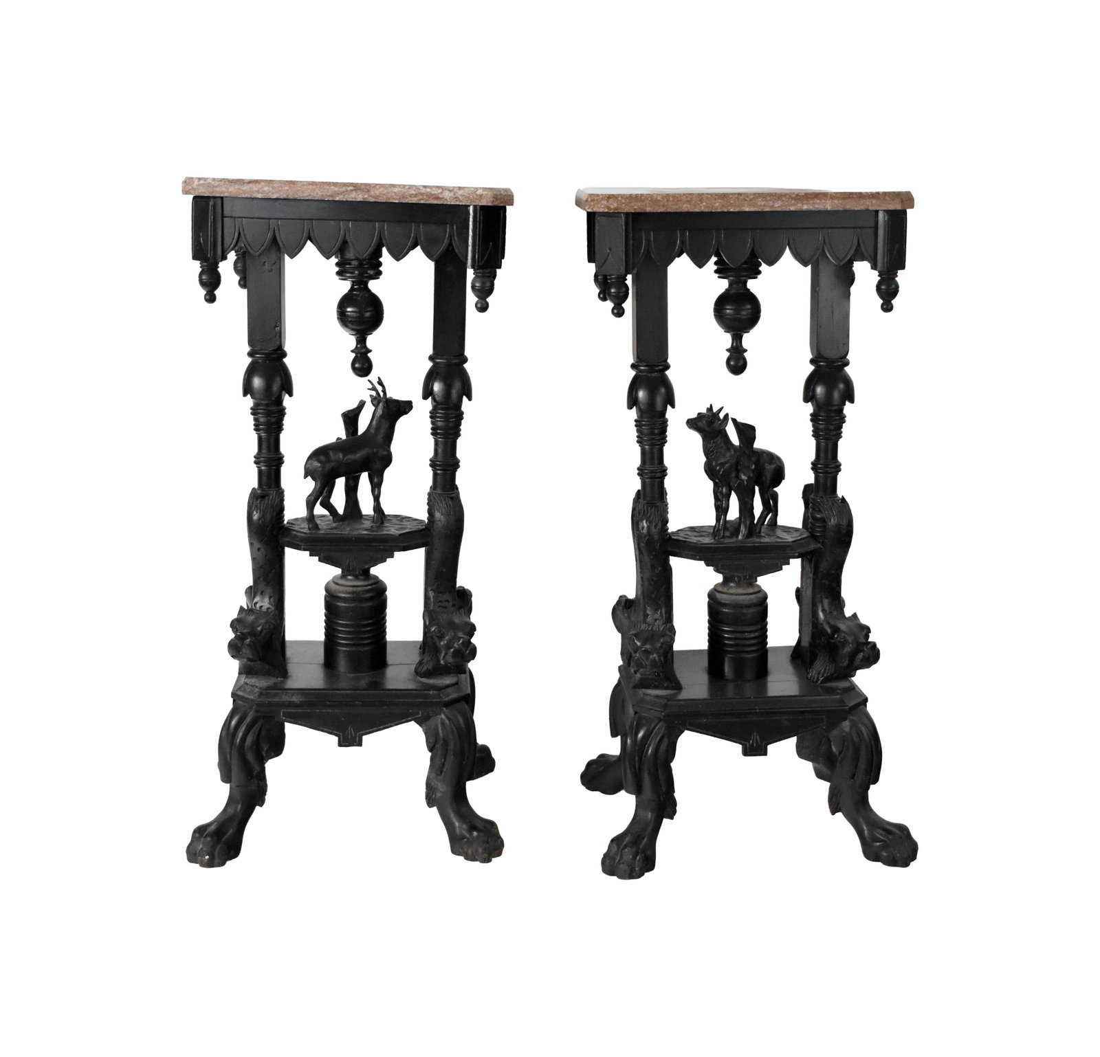 Pair of Marble Top Stands: 19th C. European. Ebonized finish. Brown marble with cut corners. Ornately carved with deer and mythological figures. Claw feet. Turned finials. 34" high x 16 1/4" wide x 11 1/2" deep. Provenance: