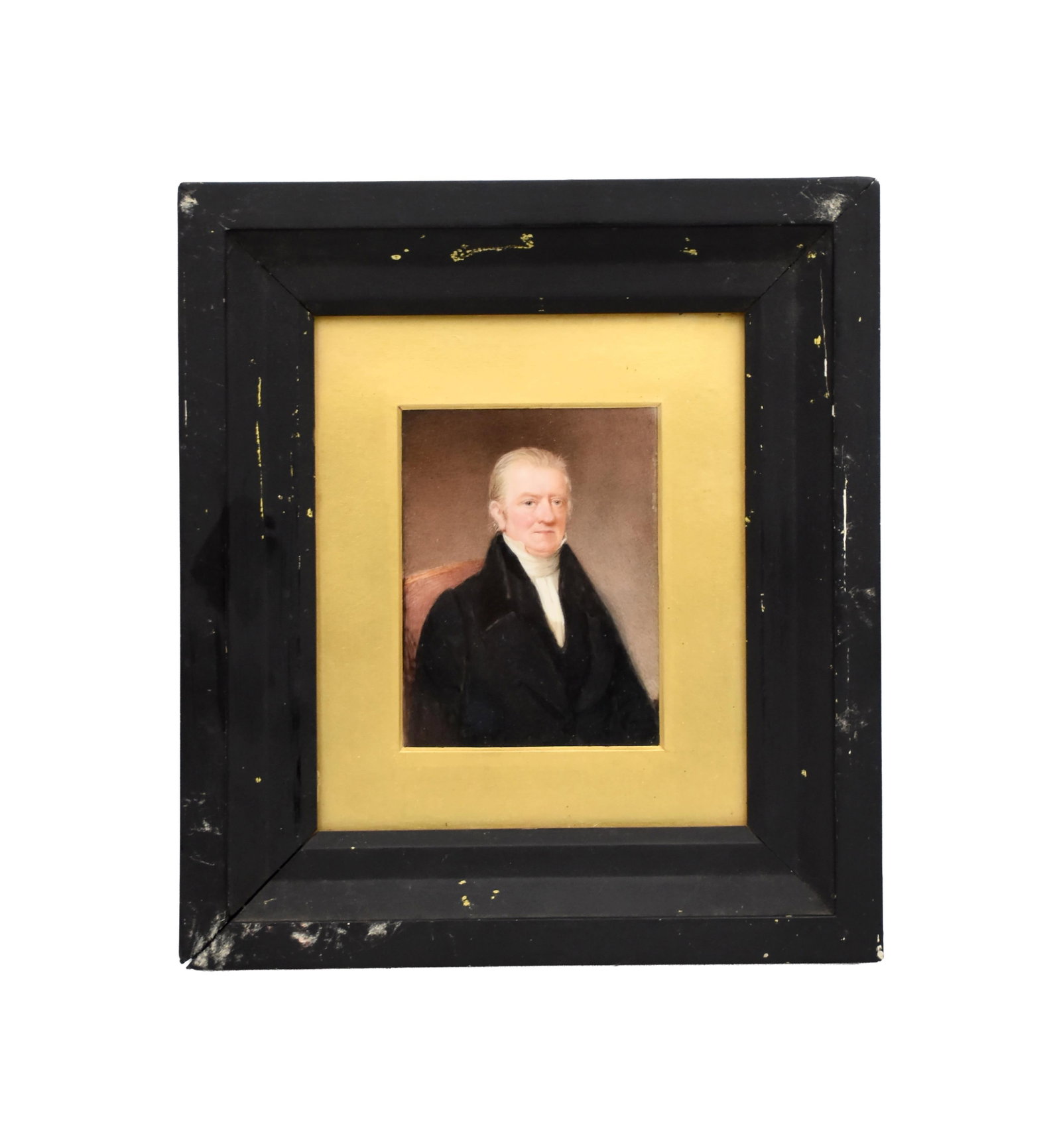 Miniature Portrait of a Gentleman: Early 19th C. On board. Unsigned. Partial hand-written note on verso as well as a David C.D. Cooke Antiques, Auckland, N.Z. sticker. Sight size: 7" high x 5 3/4" wide. In a carved wooden frame under
