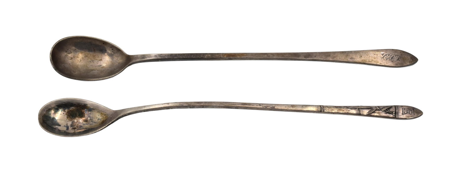 Two Tiffany & Co. Sterling Silver Iced Tea Spoons: Late 19th/Early 20th C. To include: (A) Lap Over Edge pattern. 7 3/4" long. (B) Marked "Tiffany & Co. Sterling". 7 1/2" long. 1.78 total ozt.Condition consistent with age and use. Not polished. (B)