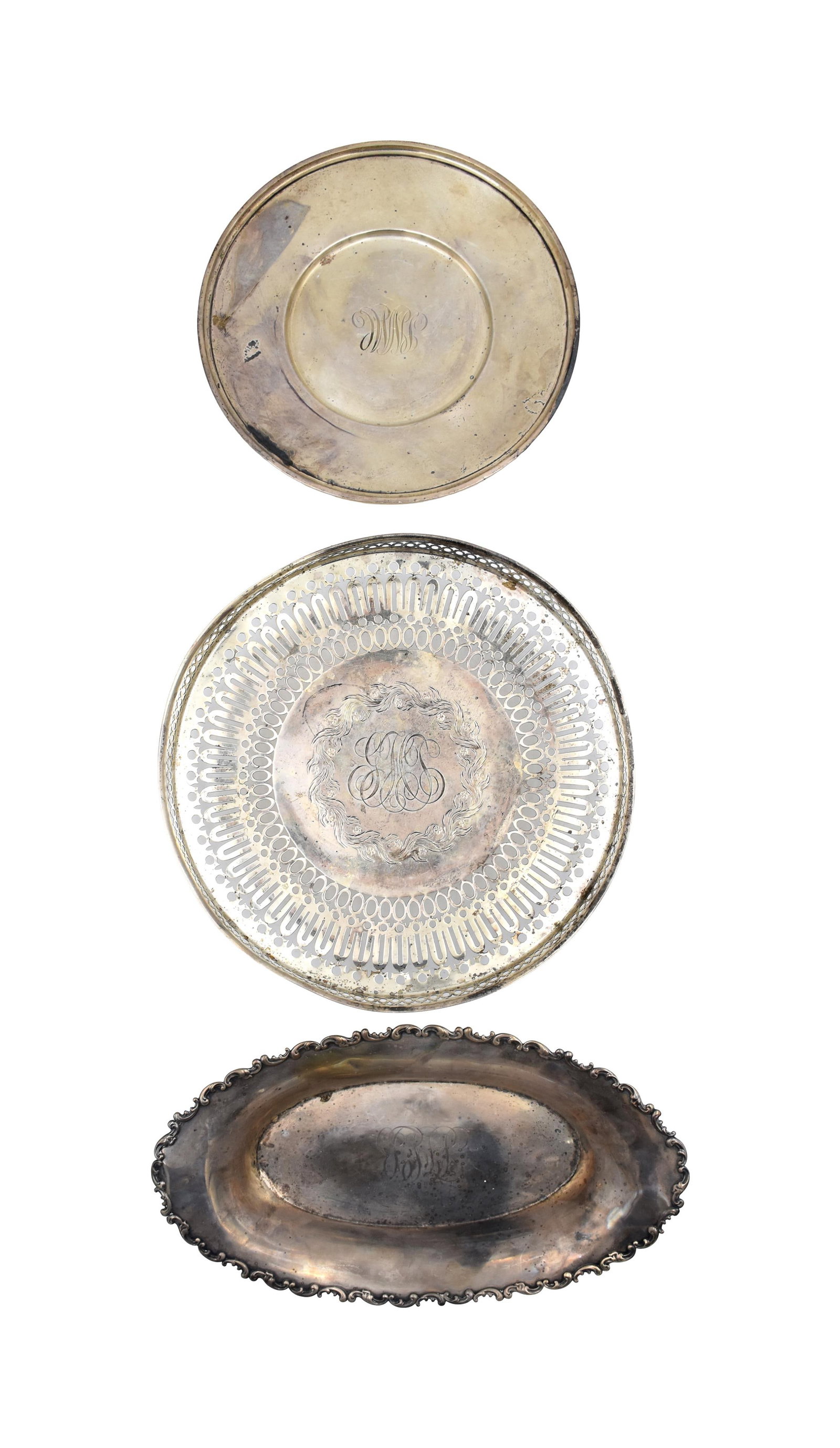 (3) Sterling Silver Trays: 20th C. To include: (A) S. Kirk & Son round tray. Marked on bottom. 9" diameter. (B) Oval tray with scalloped edge. Likely Gorham and stamped sterling on bottom. 1 3/4" high x 12" wide x 6 1/2" deep. 