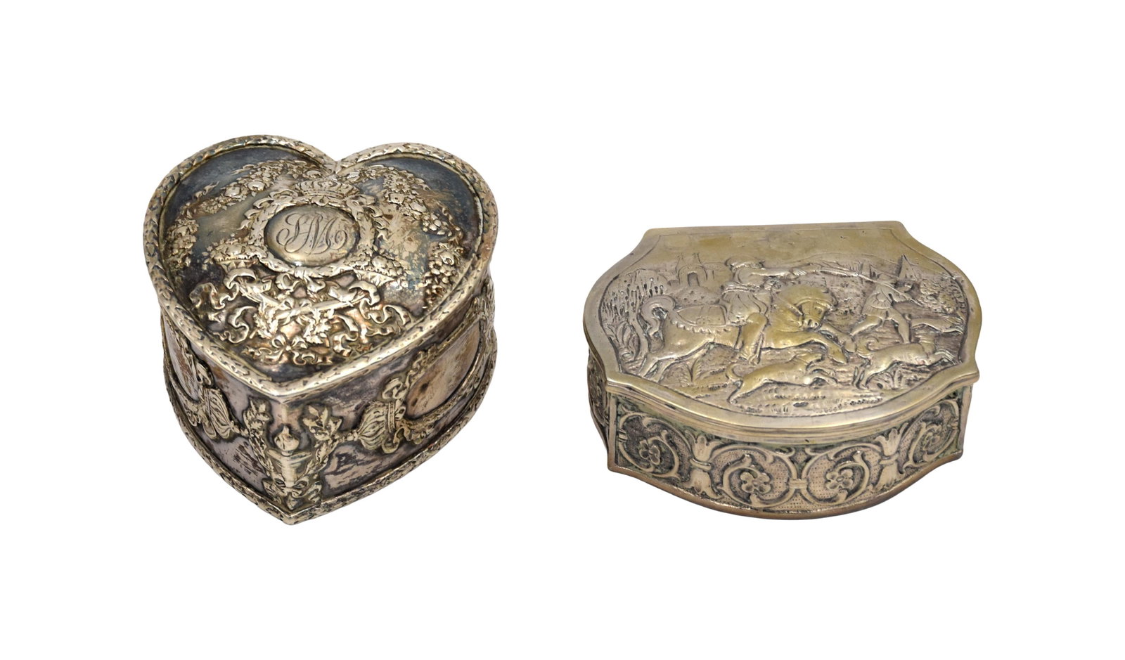 (2) Silver Trinket Boxes: Late 19th/Early 20th C. To include: (A) Heart shaped hinged box. Howard & Co. Repousse design showing cherubs, floral garlands and swirling scrollwork. Velvet lined interior. 1 3/4" high x 3" wide x