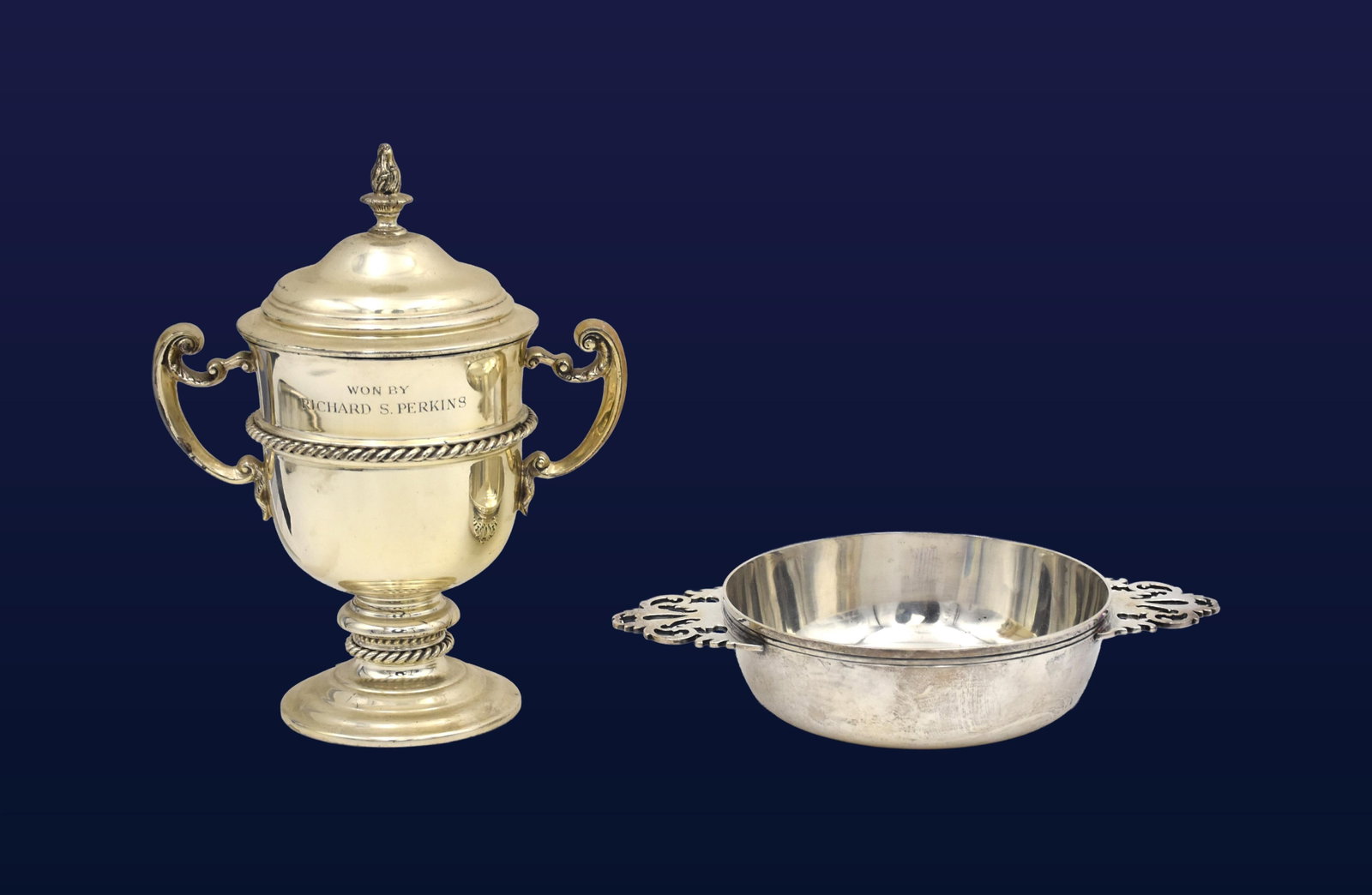 (2) Sterling Silver Items: 20th C. To include: (A) Trophy cup. Classic handles, rope-twist bands, domed lid with flame finial. Inscribed: "The Charles B. MacDonald Cup 1960" on one side and "Won by Richard S. Perkins" on the
