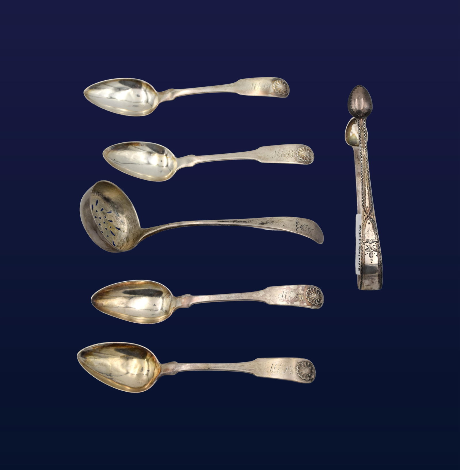(6) Sterling Silver and Coin Silver Utensils: Late 19th/Early 20th C. To include: (A) Four matching teaspoons. Shell-form decoration. Marked sterling with maker's marks on handle. 5 3/4" long. (B) Pierced strainer ladle. 6" long x 2" diameter.