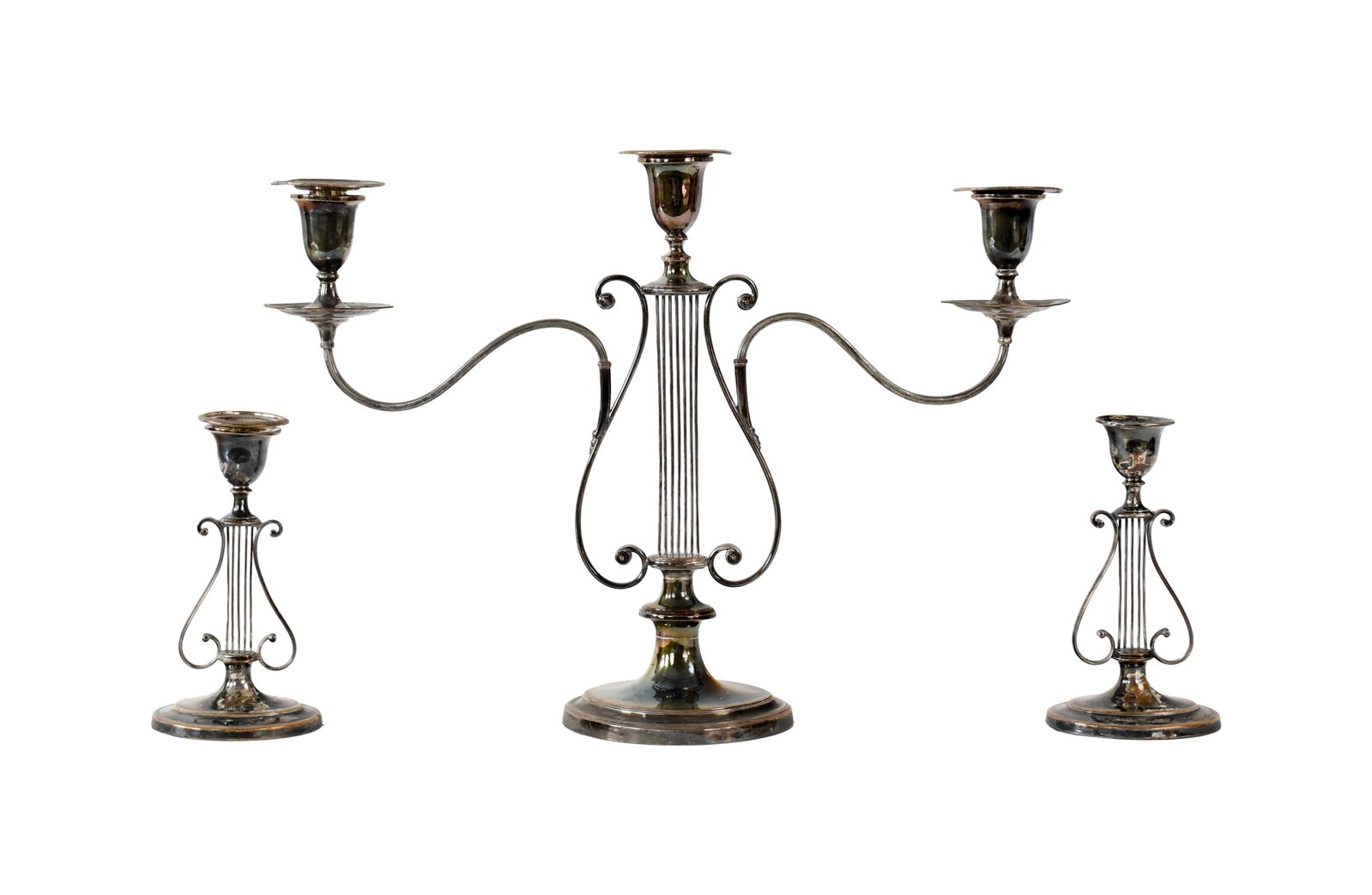 (3) Piece Sheffield Candelabra Set: Late 19th C. Includes candelabra and two single candlesticks. Openwork and scroll design. Candelabra: 15 1/2" high x 21 1/2" wide x 4 1/2" deep. Candlesticks: 8 1/4" high x 4 1/2" wide x 3 1/4" deep.