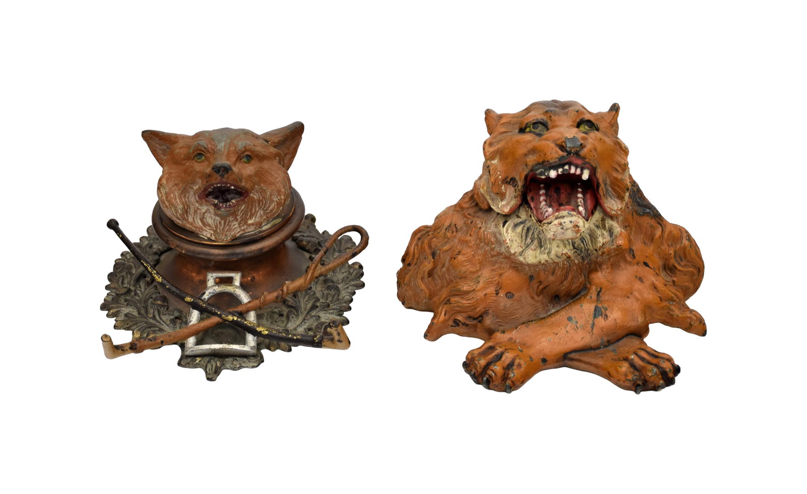 (2) Metal Animal Form Inkwells: Late 19th/Early 20th C. Both unmarked. To include: (A) Roaring lion. Head opens to reveal a glass insert. Original paint. Unmarked. 5" high x 6" wide x 6" deep. (B) Figural fox head. Head opens to