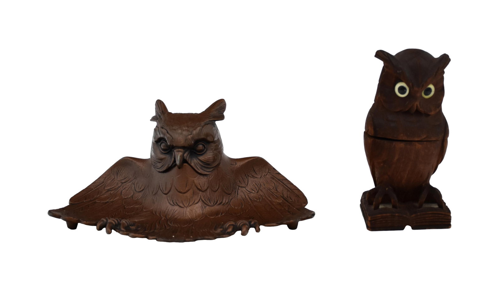 (2) Figural Owl Inkwells: Late 19th/Early 20th C. To include: (A) Large metal owl. Head opens to reveal glass insert. Bronze finish. 4" high x 9 1/2" wide x 6" deep. (B) Carved wooden owl with glass eyes. Opens to reveal