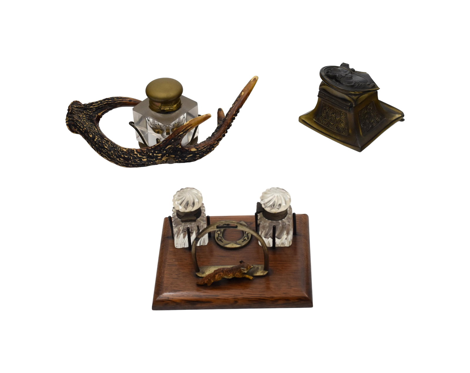 (3) Inkwells: Late 19th/Early 20th C. To include: (A) Metal horse. Head opens to reveal glass insert. 2 3/4" high x 3 1/2" square base. (B) Wood, glass and metal. Fox hunting motif with recumbent fox, penholder,