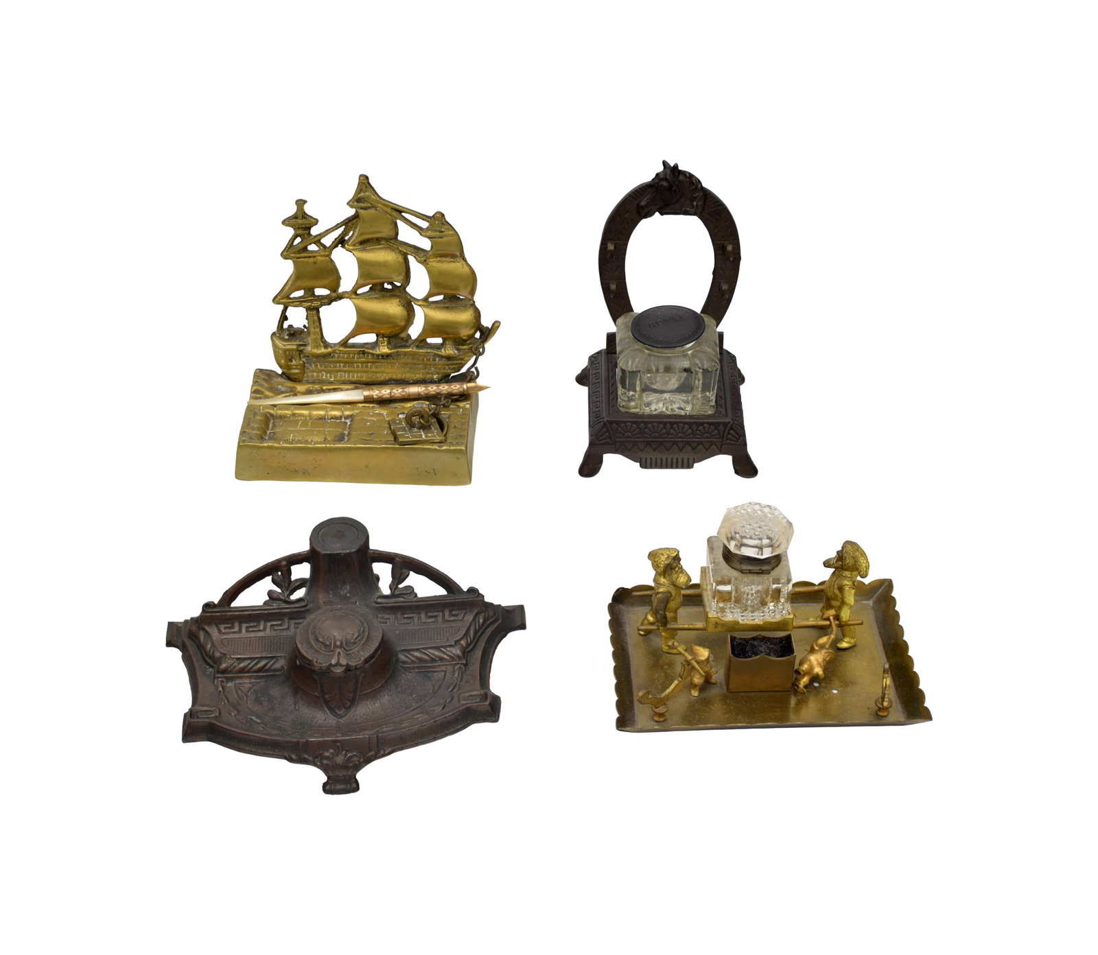 (4) Inkwells: Late 19th/Early 20th C. To include: (A) Brass. Ship form with brass insert and a hatch cover. 5 1/4" high x 5" wide x 3 1/4" deep. Comes with a gold-filled and mother-of-pearl pen. (B) Brass. Four