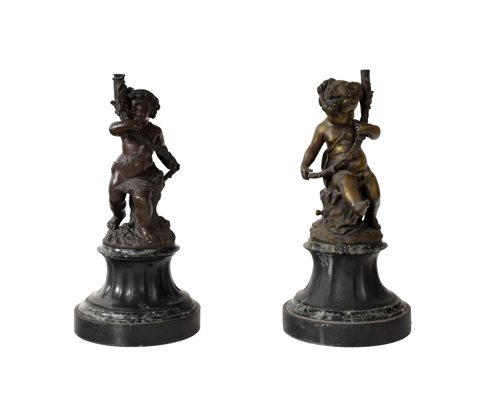 Pair of Bronze Cherubs: 19th C. Most likely French. Mounted on marble bases. Unsigned. 15" high x 7" diameter at base.They were probably originally candelabras. Upper section removed. Drilled for electricity. Marble bases