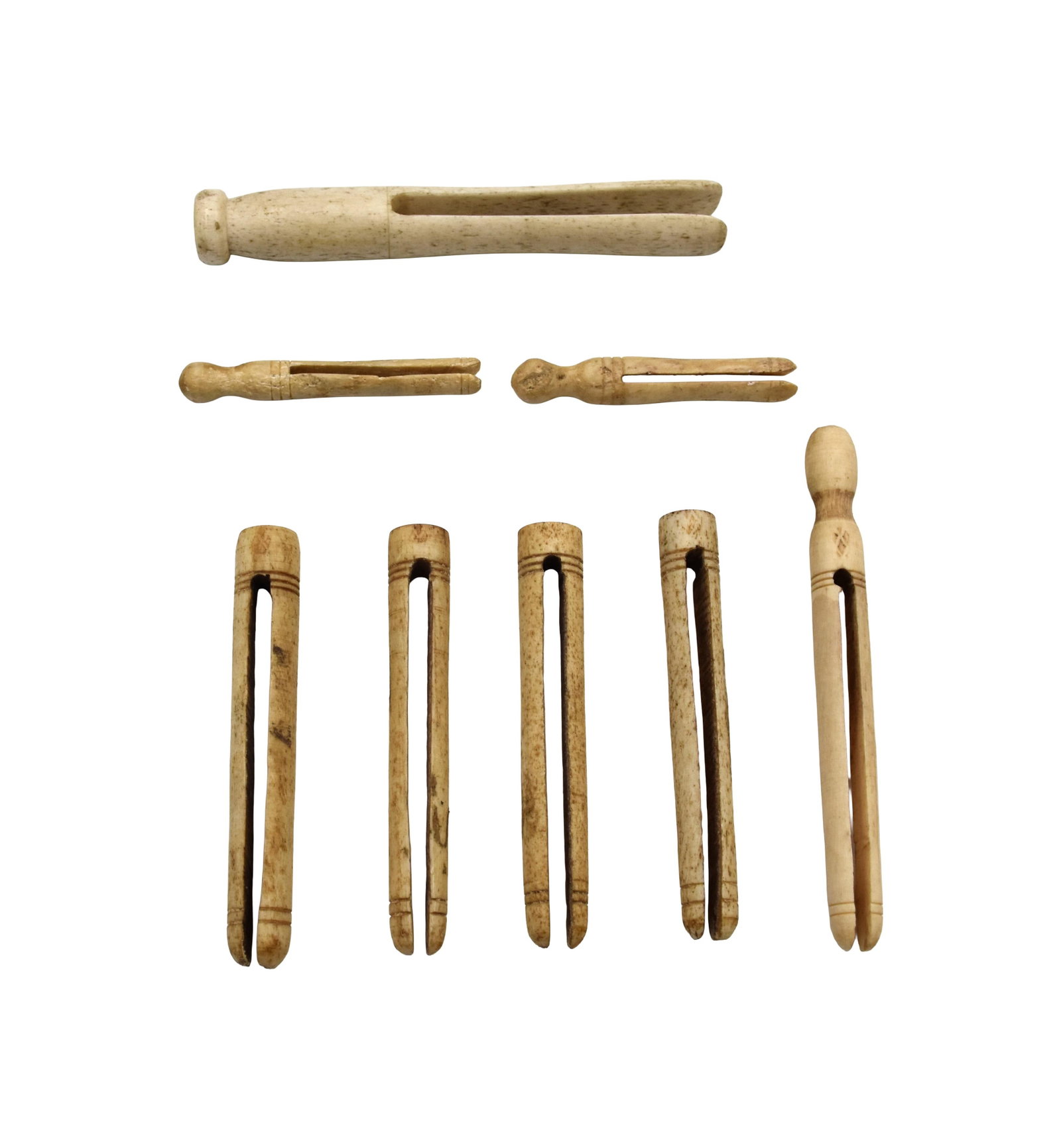 (8) Scrimshaw Clothes Pins: 19th C. Ranging in length from 2 3/4" - 5 1/8". Good condition. Shipping restriction: Please note this lot cannot be shipped out of the United States. IMPORTANT- Please note: all items are sold as