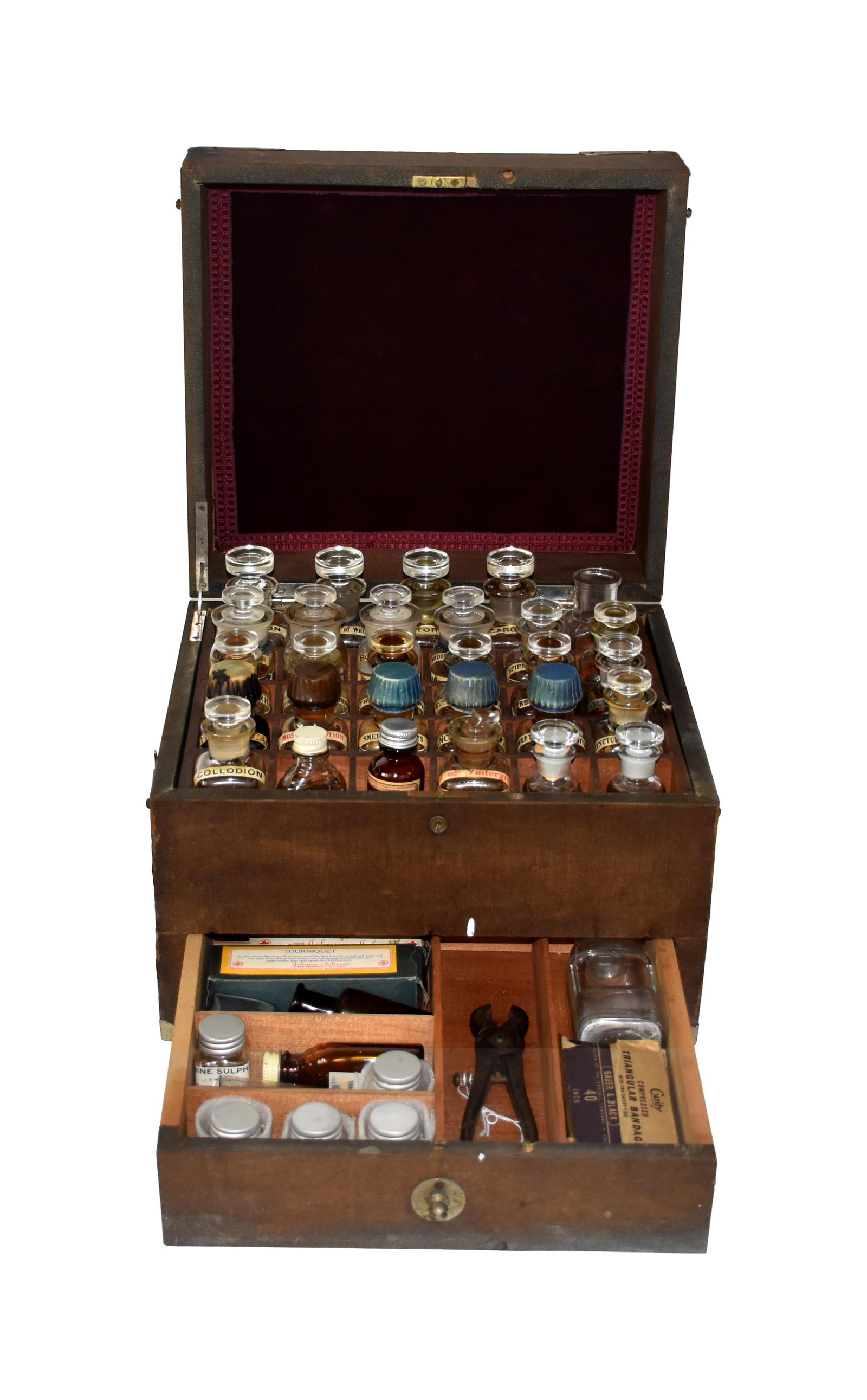 Medicine Chest: Early 20th C. Oceanic Chemical Company, New York. Cloth covered box with locking hinge lid. Contains thirty compartments for medicine vials. Some with glass stoppers and some with screw caps. Most