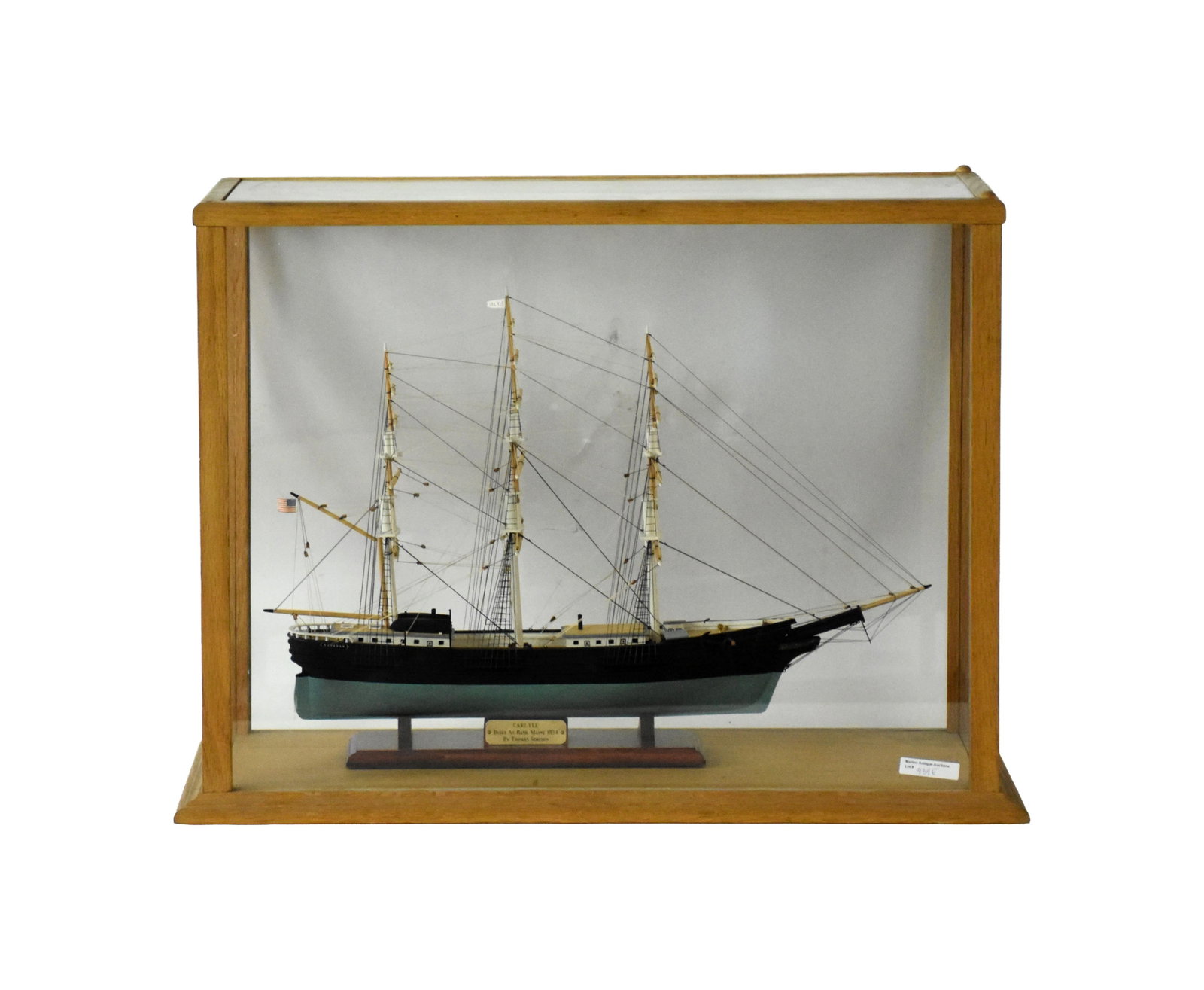 Handmade Wooden Ship Model of the CARLYLE: Late 20th C. The CARLYLE was built in Bath, Maine in 1854 by Thompson Simpson. Fully rigged. In a custom-made oak case measuring: 19" high x 24" wide x 11" deep. 14.2 lbs.Good condition. Not removed