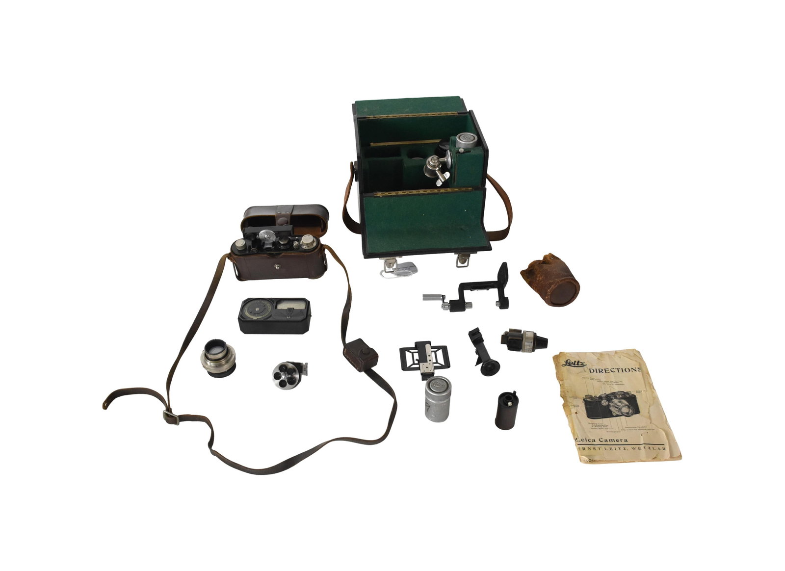 Leitz Leica Camera Model 3A: In its original fitted wooden case and includes a leather case covering the camera. Comes with: Leica meter; two extra lenses: 135 mm 5 1/2" long and second one is 1 1/2" long; viewfinder; frame finde