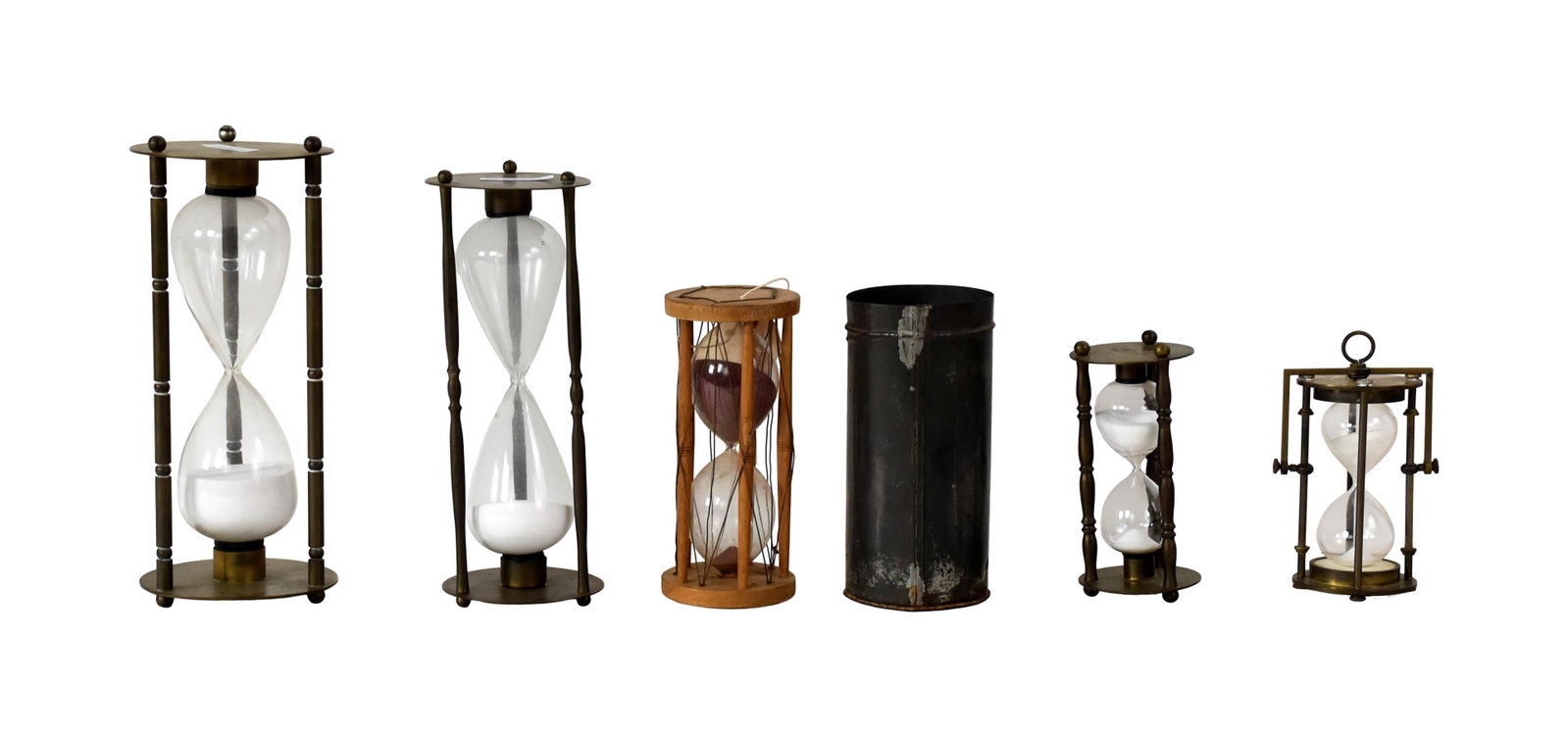 (5) Hourglasses: 19th C. Four are brass and glass ranging in size from: 6" to 11" high. Along with one German sand clocks said to have been salvaged from a ship. 48 minutes. Wood and glass. Has an old price tag of