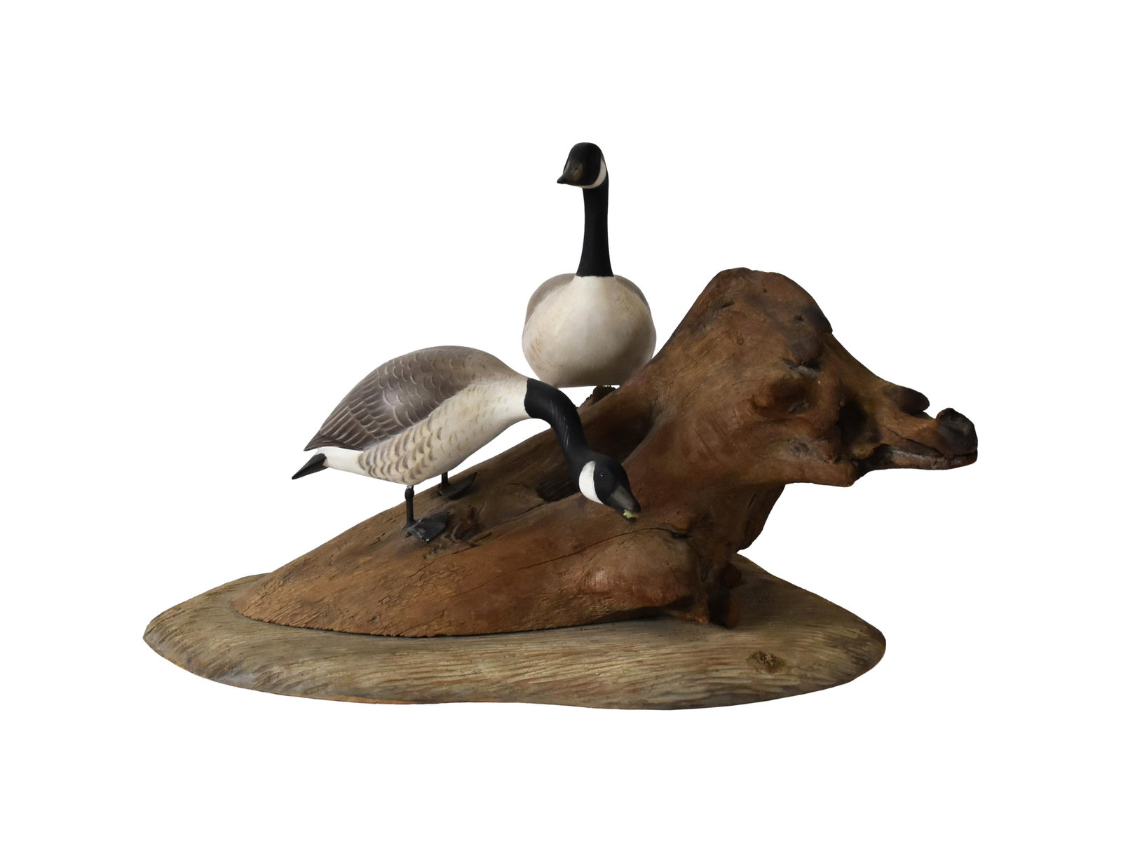 Wendell Gilley Wooden Geese Decoy: (American/Maine, 1904-1983). Two hand-carved Canada geese mounted on a driftwood base. Signed on verso and dated 1970. 11 1/2" high x 17" long x 13" deep. Good original condition. IMPORTANT- Please