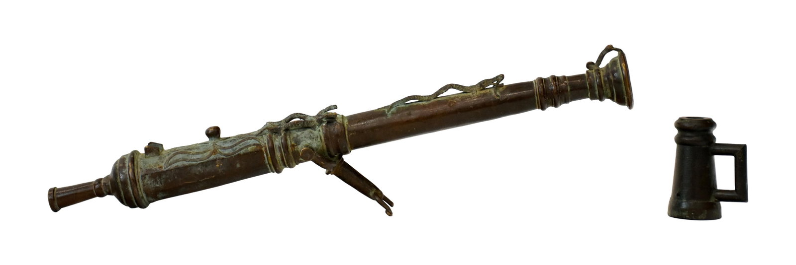 (2) Decorative Bronze Cannons: 20th C. To include: (A) Lantanka-style swivel cannon. Serpent decoration. Old patinated finish. 36 1/2" long. 19.6 lbs. (B) Mug form signal cannon. 6" high x 4 3/4" wide x 3 1/8" diameter at base.