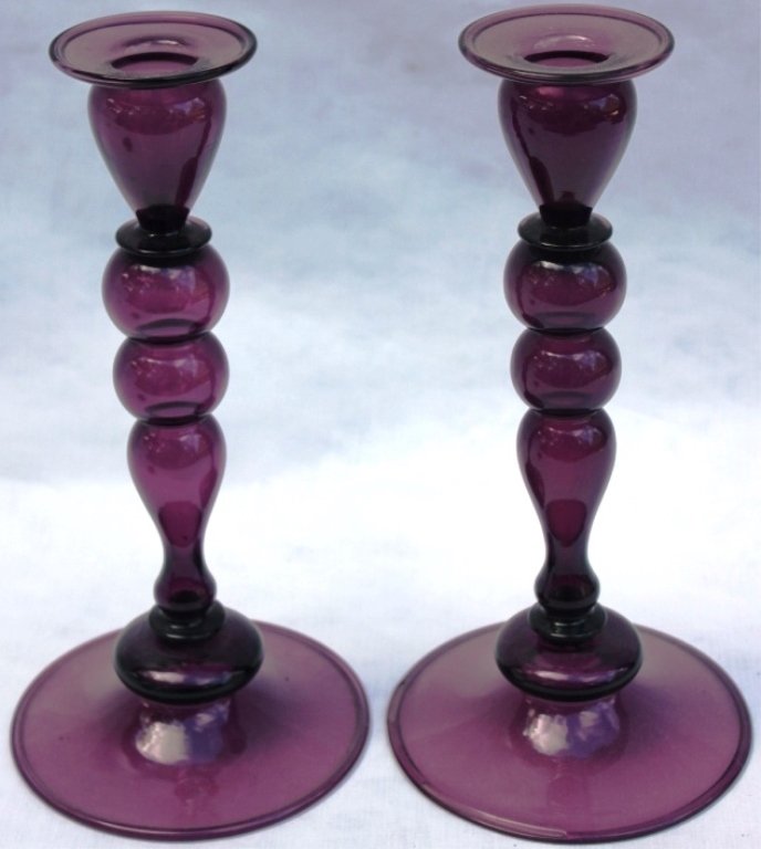 PAIR OF BLOWN AMETHYST GLASS CANDLESTICKS: POSSIBLY PAIRPOINT, 9 3/4" HIGH.