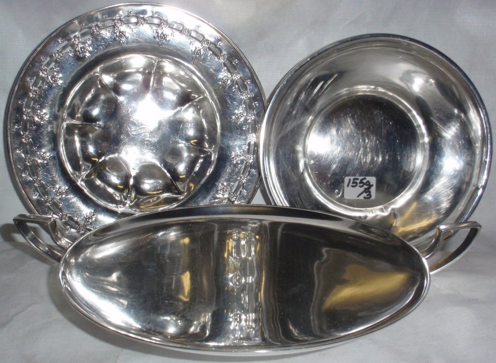 THREE STERLING SILVER BOWLS, 6 1/2", 6" & 7": IN DIAMETER, 1 HAS HANDLES, 2 ARE MONOGRAMMED AND 1 IS DENTED, 10.9 TROY OZ.