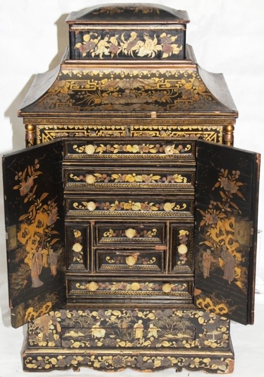 CHINESE LACQUER WARE CABINET, HINGED TOP: WITH REMOVABLE BOX FITTED MULTI DRAWER INTERIOR, GOLD CHINOISERIE DESIGN, MINOR DAMAGE WITH SOME LOSS TO LACQUER, 22 1/2" HIGH, 13 1/2" WIDE, 10 1/2" DEEP.