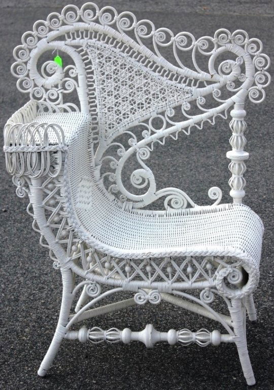 HEYWOOD BROS. WAKEFIELD CO. WICKER PHOTOGRAPHERS: CHAIR WITH ORNATE CURLICUE BORDER AND STAR CANED BACK, CA 1898, WHITE PAINTED FINISH EX KITTY MELLON COLLECTION, 43" HIGH, 33 3/4" WIDE, 19 1/4" DEEP.