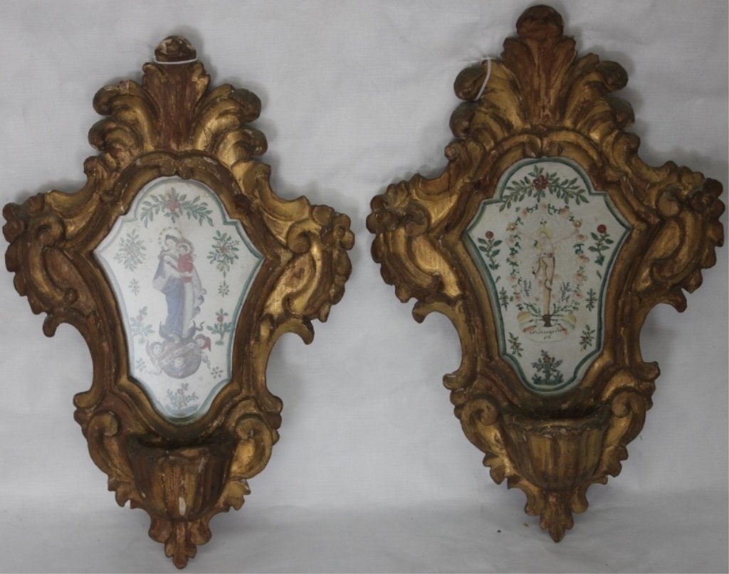 PAIR OF EARLY 19TH C CARVED AND GILDED ITALIAN: HOLY WATER FONTS, WATERCOLOR DRAWINGS IN CENTER DEPICTING THE CRUCIFIXION AND MADONNA AND CHILD, SOME PAINT LOSS AND REPAIR, 15" X 9 1/2."