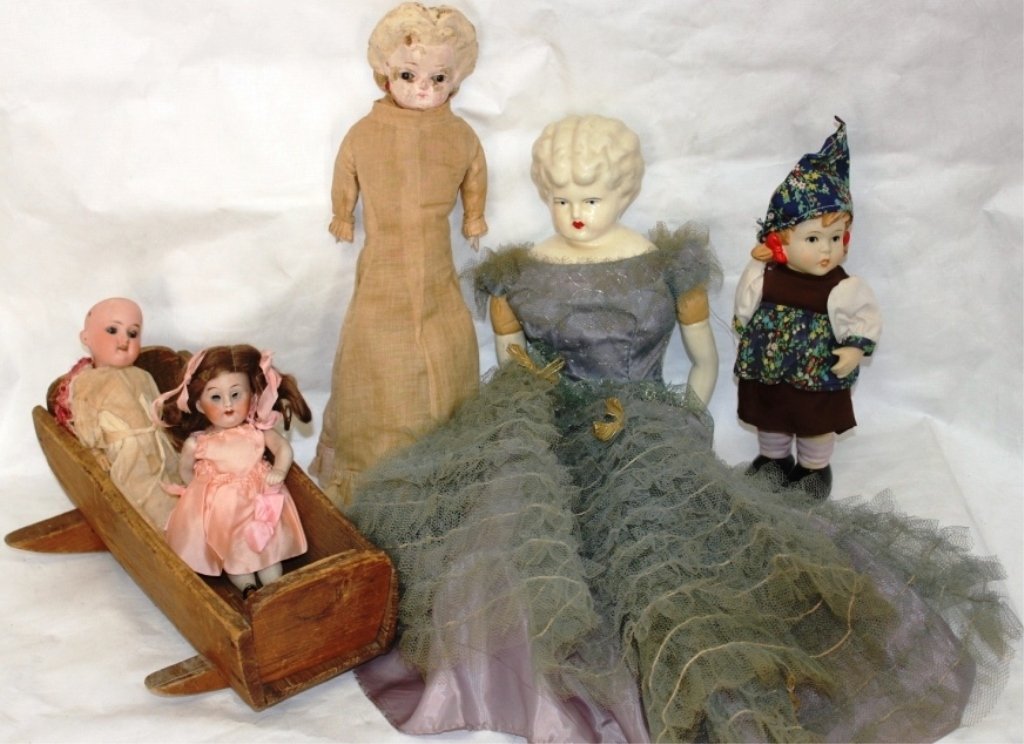 FIVE OLD DOLLS AND DOLL CRADLE TO INCLUDE: 20" CHINA HEAD WITH CLOTH BODY, EARLY 16" COMPOSITION HEAD DOLL WITH BLOWN GLASS EYES, CARVED WOODEN HANDS AND FEET; 7" JOINTED PORCELAIN DOLL, EYES MISSING; 9" BISQUE HEAD ARMAND MARSEILLE 390 JOINTE