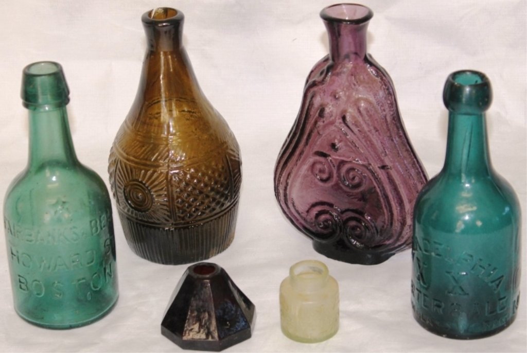 MISCELLANEOUS BOTTLES INCLUDING TWO SODAS,: KEENE GEOMETRIC DECANTER AS IS (W/CRACK, HOLE, CHIPPED AND GLUED TOP), SALTS BOTTLE, CLEAVENGER BROS. SCROLL FLASK, AMETHYST PYRAMID INK, MISSING TOP, ALL - AS IS, 1 3/4" TO 7" HIGH.