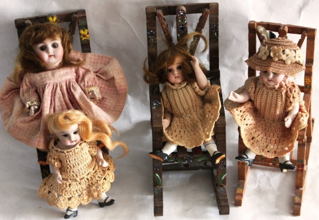 COLLECTION OF FOUR SMALL JOINTED PORCELAIN: GERMAN DOLLS, WITH SLEEP EYES, 4 3/4" - 6 1/2" HIGH IN OLD CLOTHES, WITH THREE CLOTHES PIN CHAIRS (2 ROCKERS AND 1 STRAIGHT).