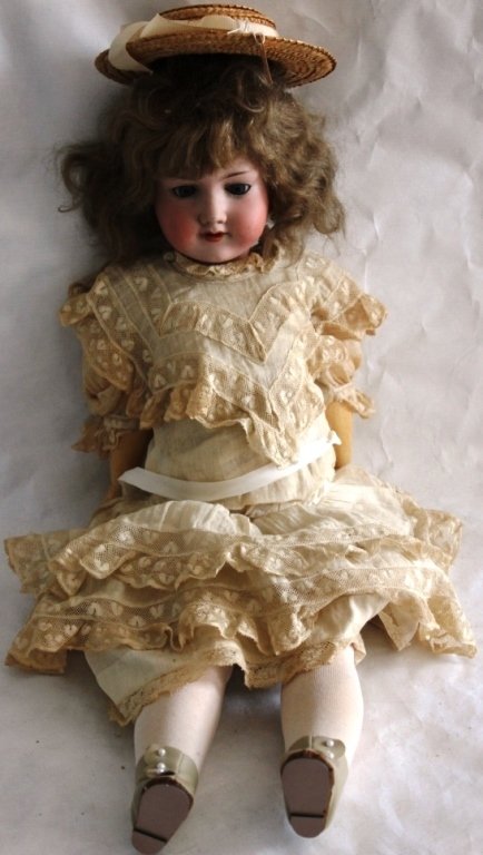 GERMAN BISQUE HEAD DOLL, JOINTED COMPOSITION: BODY, A M BLUE CROSSED SLEEP EYES, OPEN MOUTH.