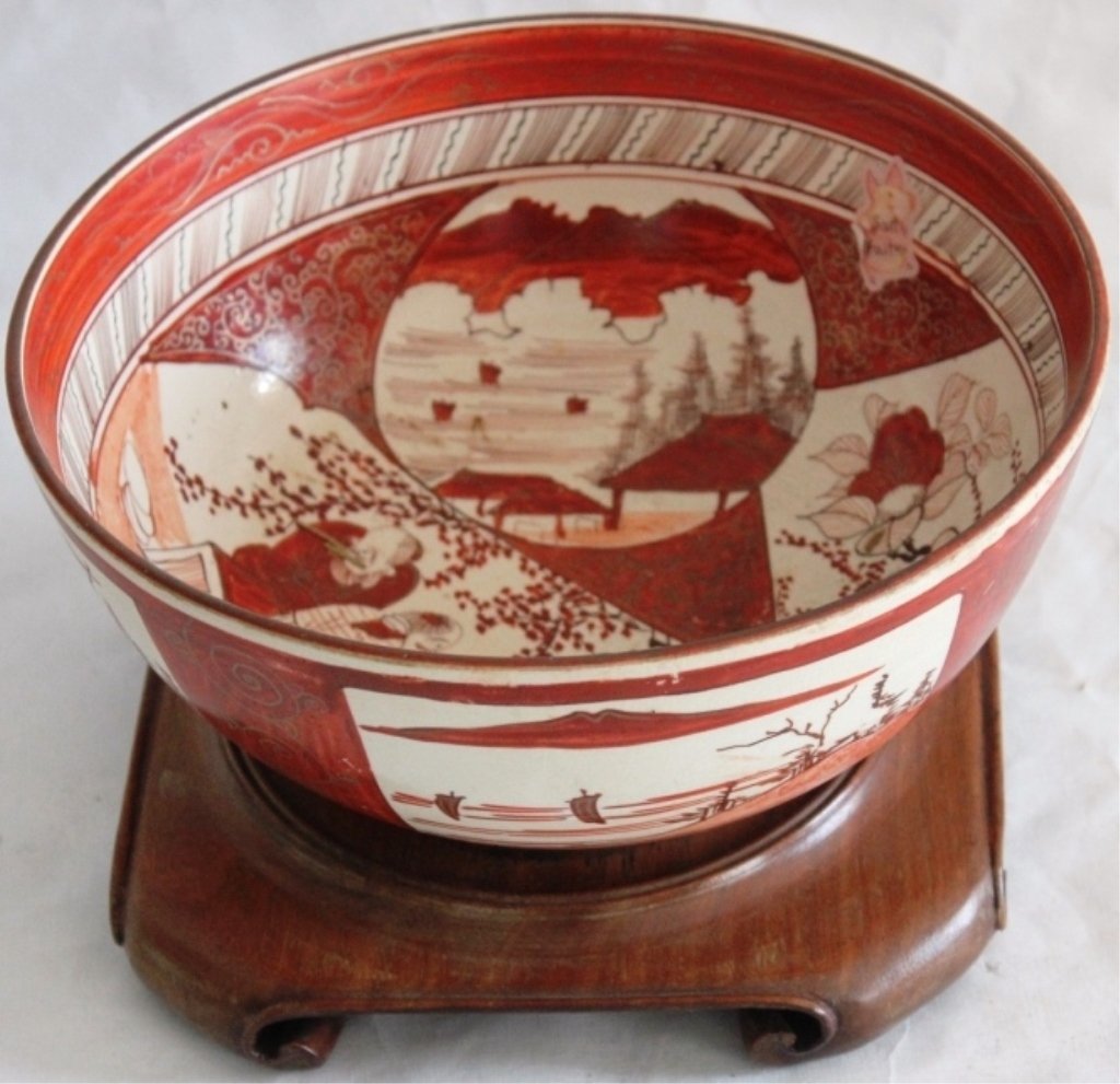LATE 19TH C KUTANI BOWL, VARIOUS SCENES, SCHOLARS,: LANDSCAPE AND FLOWERS 4 1/2" HIGH, 9 1/4" DIAMETER, ON LATER TEAK BASE.