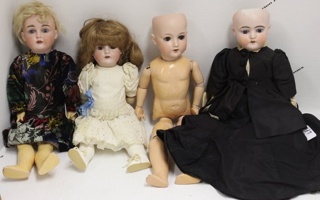 FOUR GERMAN BISQUE HEAD DOLLS TO INCLUDE: TWO KESTNERS (?), A "167", BLUE SLEEP EYES, OPEN MOUTH, COMPOSITION BODY, FLAKE AT CORNER OF EYE, 18"; A "167", BROWN EYES, OPEN MOUTH, WORN PAINT AND HAIRLINE BY EAR, 15"; A "150", BLUE SLEEP EYES, O