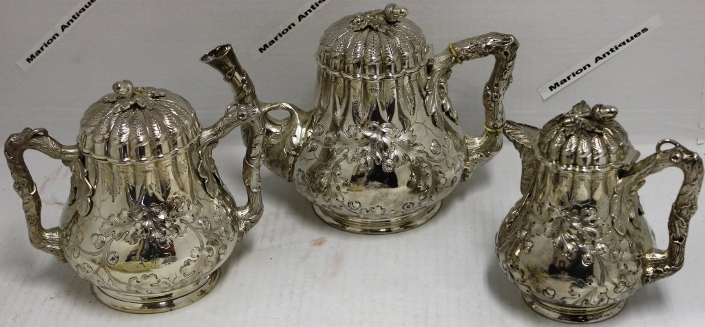 EXCEPTIONAL MID-19TH C 3 PIECE COIN SILVER: TEA SET; BIGELOW BROS. AND KENNARD, BOSTON. EXTREMELY ORNATE RAISED CHESTNUT AND LEAF DESIGN WITH TREE BRANCH STYLE HANDLES; 6 3/4" HIGH, 7" HIGH, 7 1/2" HIGH; 69.31 OZT; HOYT AND ANN WATSON ESTATE