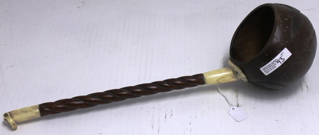 ANTIQUE 19TH C WALRUS IVORY AND EXOTIC WOOD: COCOANUT DIPPER, 16 1/2" LONG, 3 1/4" DIAMETER CUP HAS A CARVED EAGLE; HANDLE HAS A ROPE TWIST DESIGN; HANDLE AT TIP IS DAMAGED