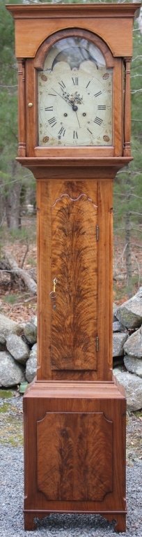 AMERICAN EARLY 19TH C TALL CASE CLOCK, BONNET TOP: HAS TOMBSTONE SHAPED GLAZED GLASS DOOR FLANKED BY TURNED COLUMNS; PAINTED METAL MOON PHASE DIAL AND FACE WITH SAILING SHIP AND LANDSCAPE; SECONDS HAND; BRASS OSBOURNE WORKS; CROTCH MAHOGANY CENTRAL DO