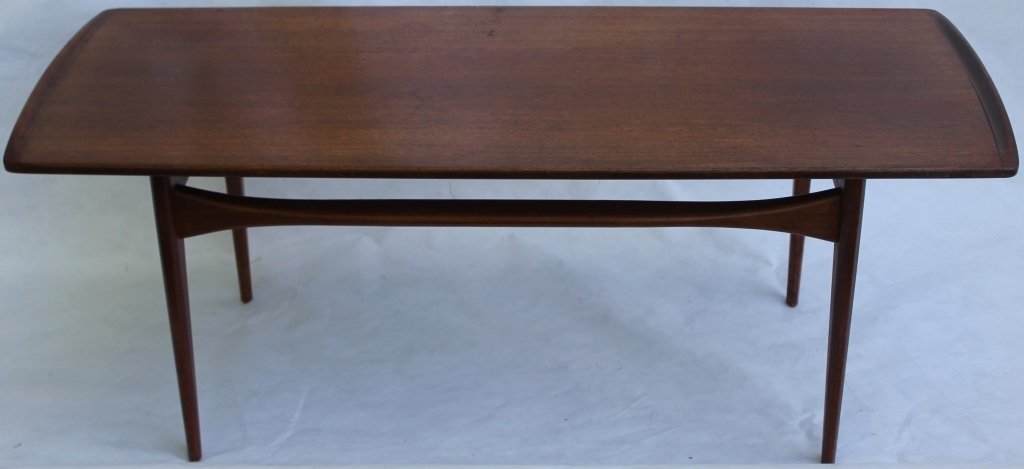 MID CENTURY TEAKWOOD DANISH TABLE DESIGNED FOR: FRANCE AND DAVERKOSEN IMPORTED TO JOHN STREET, NY; DESIGNED FINN JUHL; 17 3/4" HIGH, 47" LONG, 20 1/4" DEEP