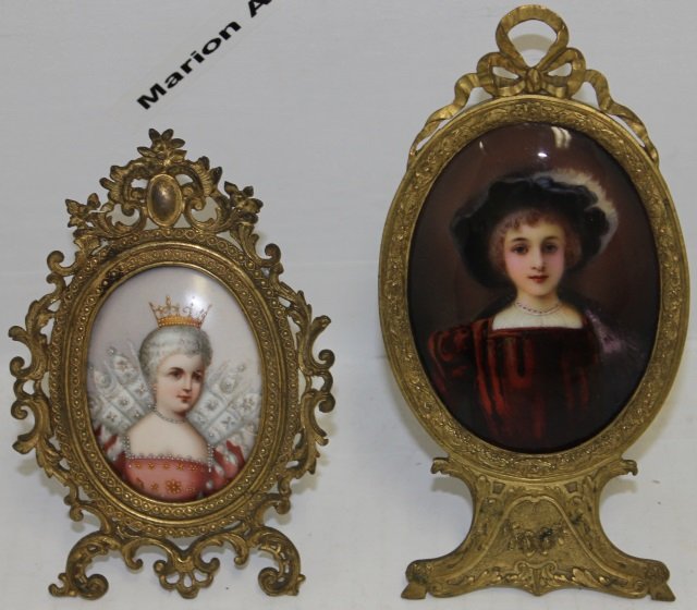 2 MINIATURE 19TH C PORTRAITS, FEMALES.: ONE IS ON PORCELAIN AND DEPICTS A FEMALE WEARING A CROWN. THE OTHER IS A LIMOGES ENAMEL PORTRAIT OF A YOUNG GIRL. BOTH ARE IN PERIOD ORNATE BRASS FRAMES. 5 1/2" HIGH AND 6 3/4" HIGH.