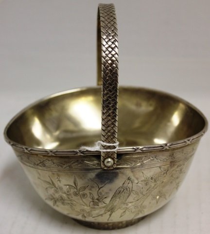 19TH C GORHAM STERLING SILVER WOVEN SWING HANDLE: BASKET WITH BIRD DESIGN. MONOGRAM, SMALL DENT, 5 3/4" HIGH, 5" WIDE, 3 1/4" DEEP, 6.1 TROY OZ.