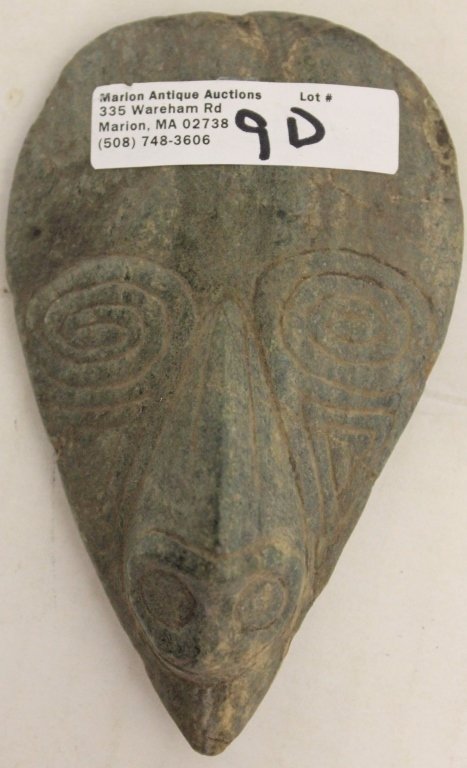 COMPOUND BIRD HEAD FIGURAL AX. TRIPLE HEAD: IMAGERY. BIRD HEAD VISIBLE. WHEN INVERTED ANOTHER FACIAL CHARACTER APPEARS AS NOSE AND THIRD IMAGE WHEN YOU INCORPORATE THE NOSE AND BIRD HEAD WINGS PORTRAYED AS EYES. MADE OF GREY FINE GRAINED STONE.