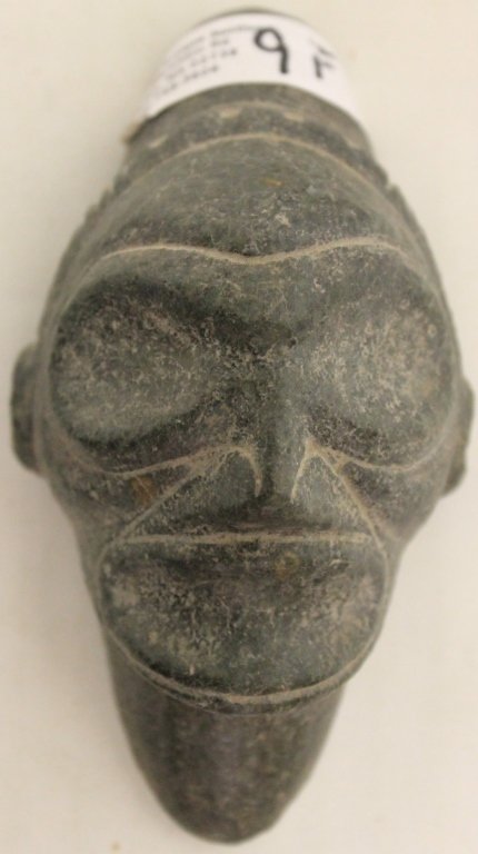 NICELY CARVED ANCESTRAL HEAD. WELL DEFINED HEAD: BAND FACIAL FEATURES. FACE SITES THREE POINTER TYPE BASE. ANDESITE STONE. 4 1/2" L, CA 1000 - 1500. ORIGIN UNKNOWN BUT LIKELY FROM THE DOMINICAN REPUBLIC OR PUERTO RICO. FORMER ROBERTS COLLECTION
