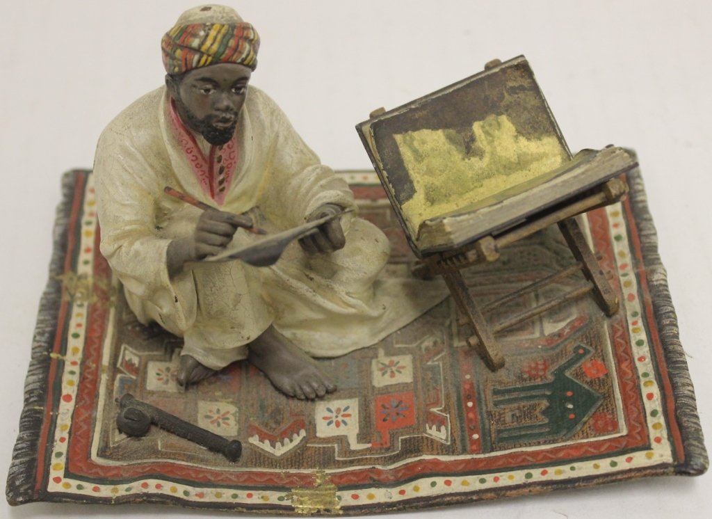 CA 1900 VIENNA COLD PAINTED BRONZE ARAB SCHOLAR: ON A RUG, RUG IS SLIGHTLY BENT AND THERE ARE 2 AREAS OF PAINT LOSS, MARKED WITH BERGMAN MONOGRAM. 3 1/4" HIGH, 5 3/4" WIDE, 4 1/4" DEEP._x000D_