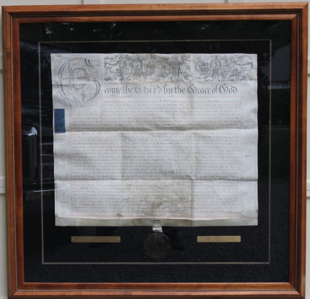 FRAMED INDENTURE DOCUMENT, SIGNED BY GEORGE III: KING OF ENGLAND. IT IS ON VELLUM AND DATED FEBRUARY 12, 1801. 4 1/2" ROYAL WAX SEAL AND TWO TAX STAMPS AND A LETTER OF PROVENANCE AND AUTHENTICITY, DOCUMENT IS 27 1/4" X 32 1/4". SHADOW BOX IS 47 1/4"