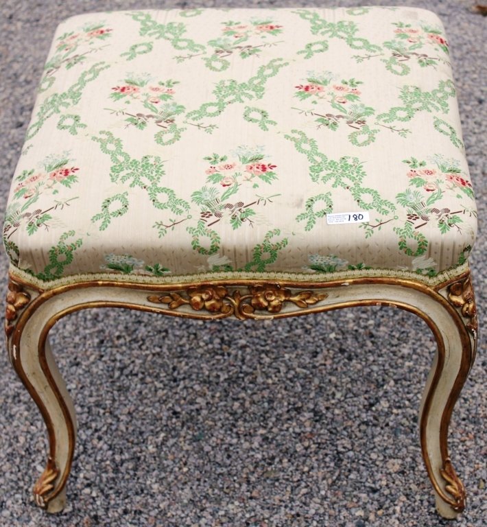 18TH C FRENCH FOOTSTOOL, PAINTED AND GILDED FINISH: CABRIOLE LEGS, CARVED FLORAL DESIGN 16 1/2" H X 20" X 20" TOP, MODERN FLORAL UPHOLSTERY.