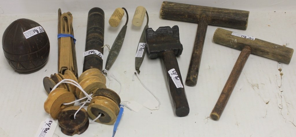 23 PIECES OF WHALING RELATED ITEMS TO INCLUDE: 2 BONE CODFISH HOOKS, SAILOR'S NEEDLECASE WITH NEEDLES, 8 WOODEN NET MENDERS, 1 CARVED COCONUT SHELL, 2 SLENDER MALLETS, 1 LARGE MALLET, 8 PULLEY WHEELS, ETC.