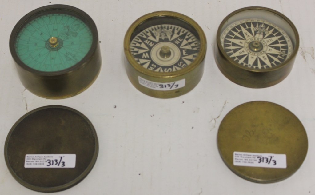 THREE LATE 19TH C BRASS CASED COMPASSES. ONE IS: R. MERRILL, NEW YORK, 1 1/8" HIGH X 3" DIAMETER WITH COVER. ONE IS UNMARKED 1 3/8" HIGH X 2 7/8" DIAMETER. THE LAST IS BOWSKILL, LONDON WITH COVER, 2 7/16" HIGH X 3 1/4" DIAMETER.