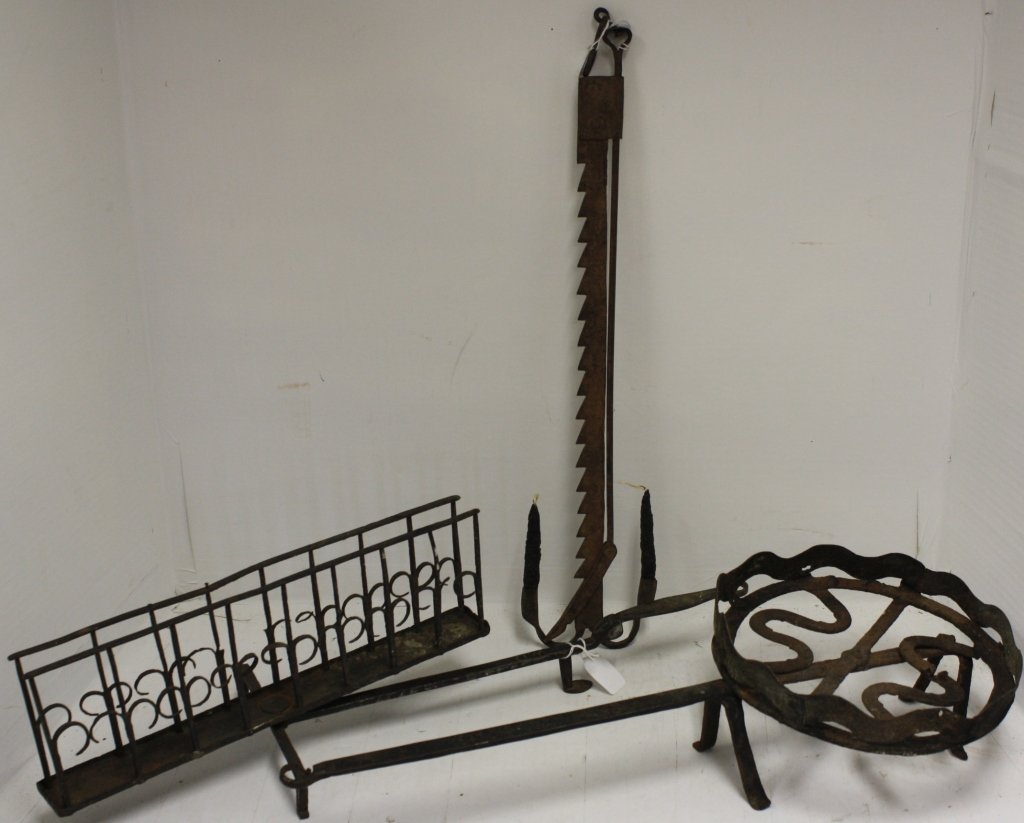 THREE 18TH C WROUGHT IRON PIECES TO INCLUDE: ORNATE TOASTER SIGNED W.D., 24" LONG, AN ADJUSTABLE TRAMMEL CANDLEHOLDER, 22" HIGH AND A FOOTED TOASTER 22 1/2" LONG.
