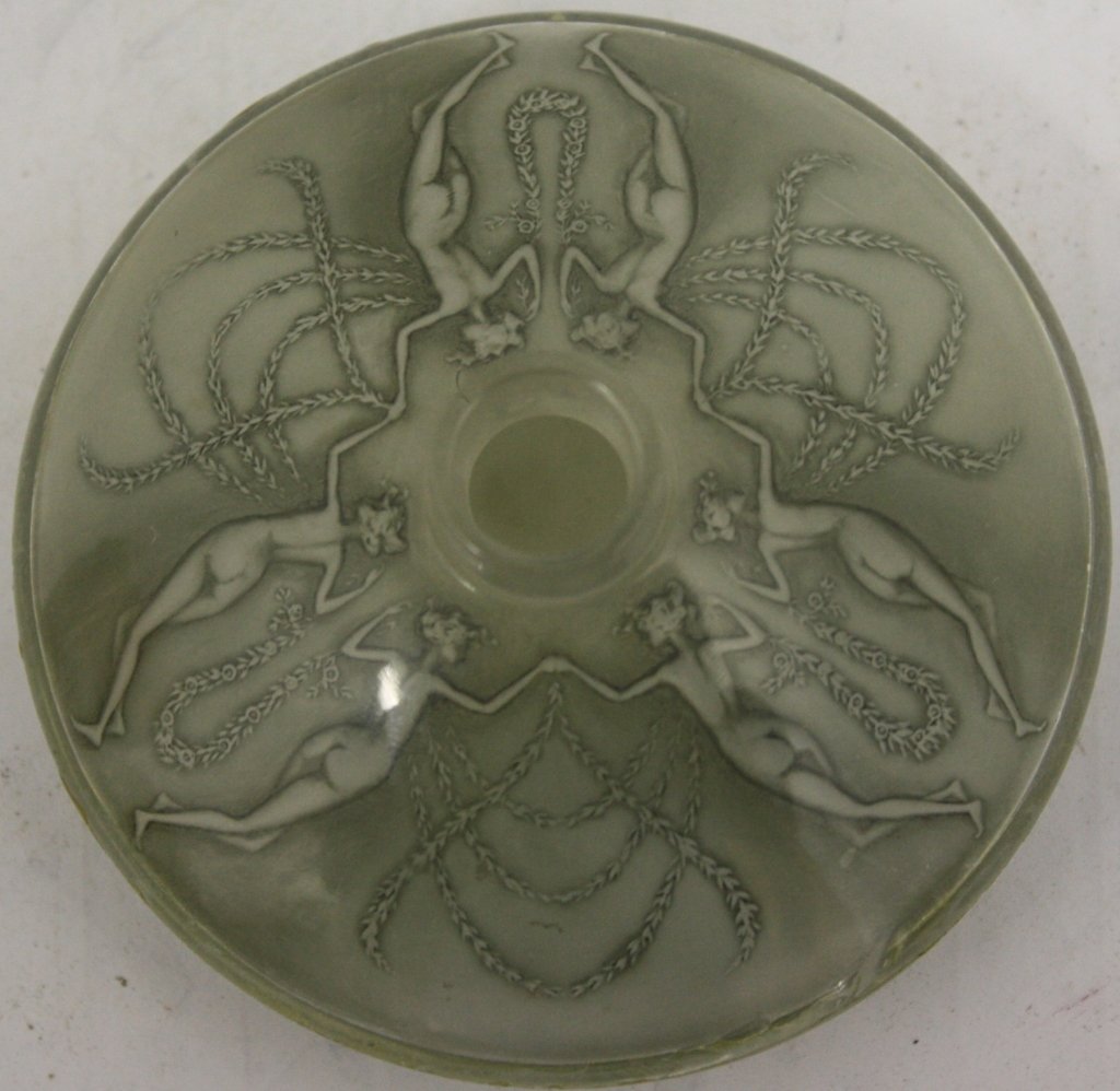 RENE LALIQUE CLEAR AND FROSTED GLASS FALCON,: CA 1912, MOLDED UNDERNEATH WITH A FREIZE OF DANCING NUDE MAIDENS WITH GARLANDS, ENGRAVED LALIQUE AND 24. 1 7/8" HIGH. LACKING STOPPER SHOWS POSSIBLE REPAIR TO WAIST AND SLIGHT CRACK AT CENTER. PURCHAS